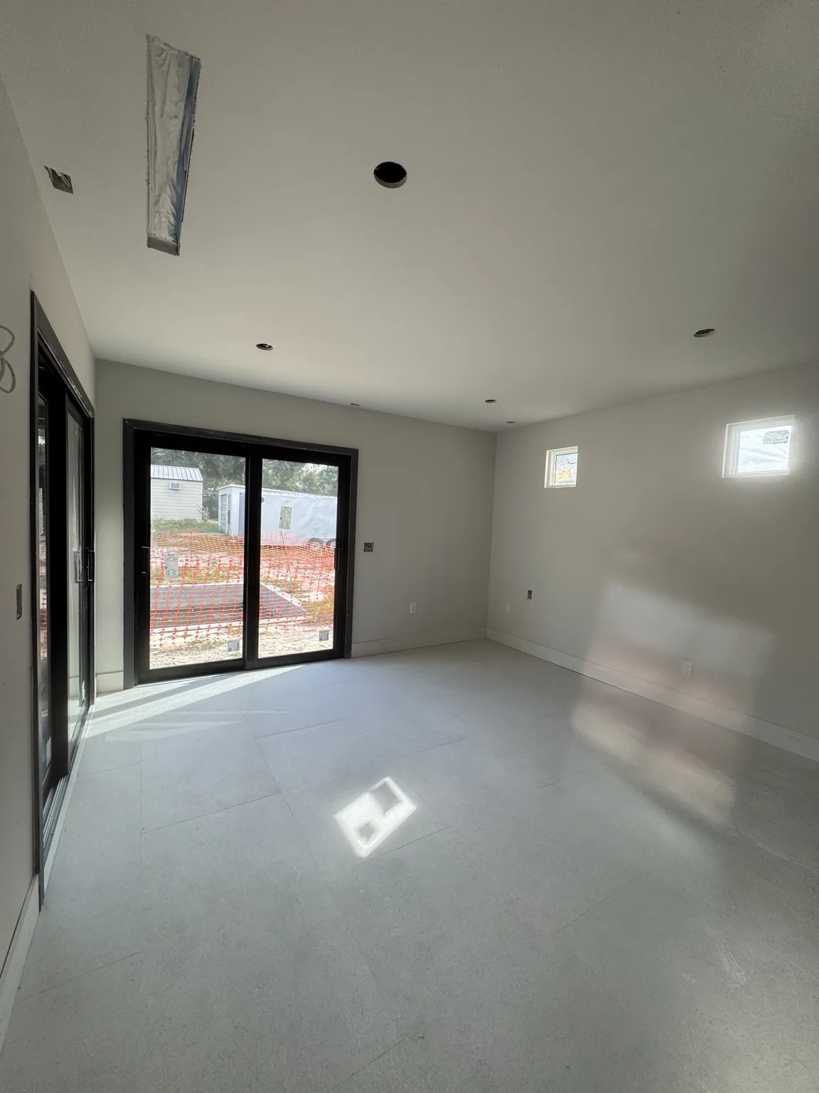 Nero Construction drywall work in a residential room with large windows